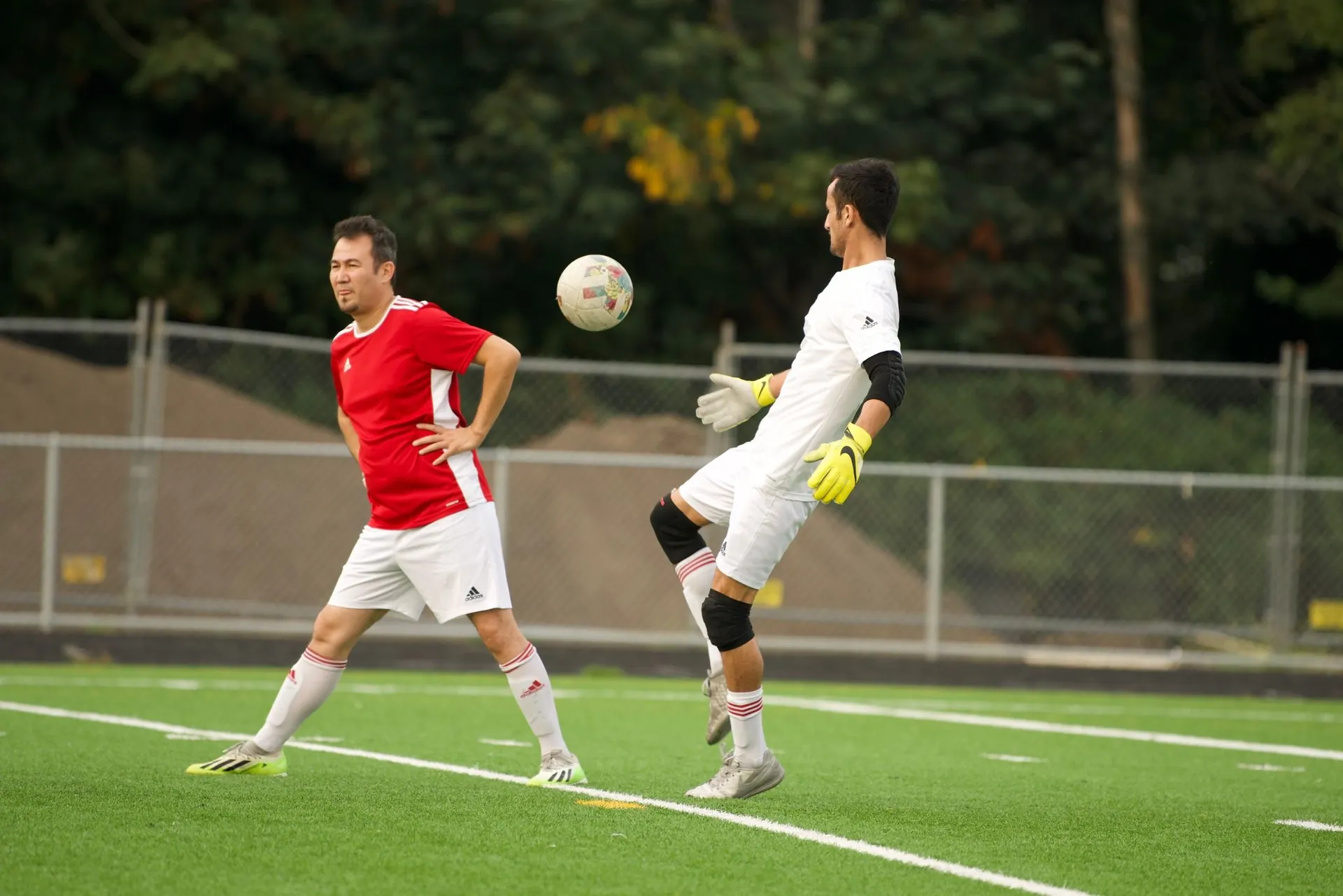 Player and goalkeeper during a match