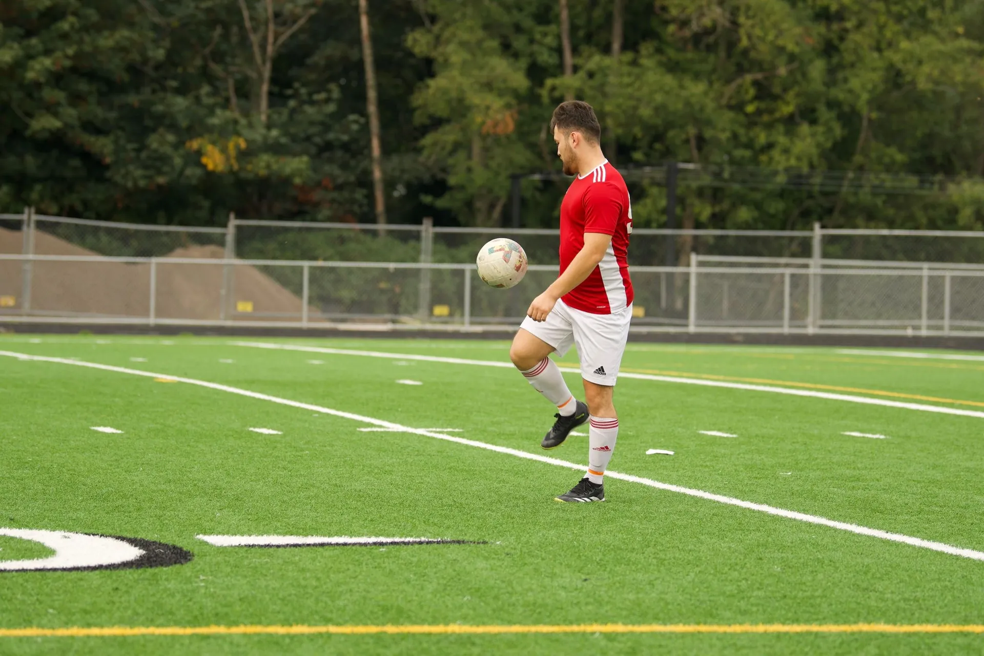 Player juggling the ball on the field
